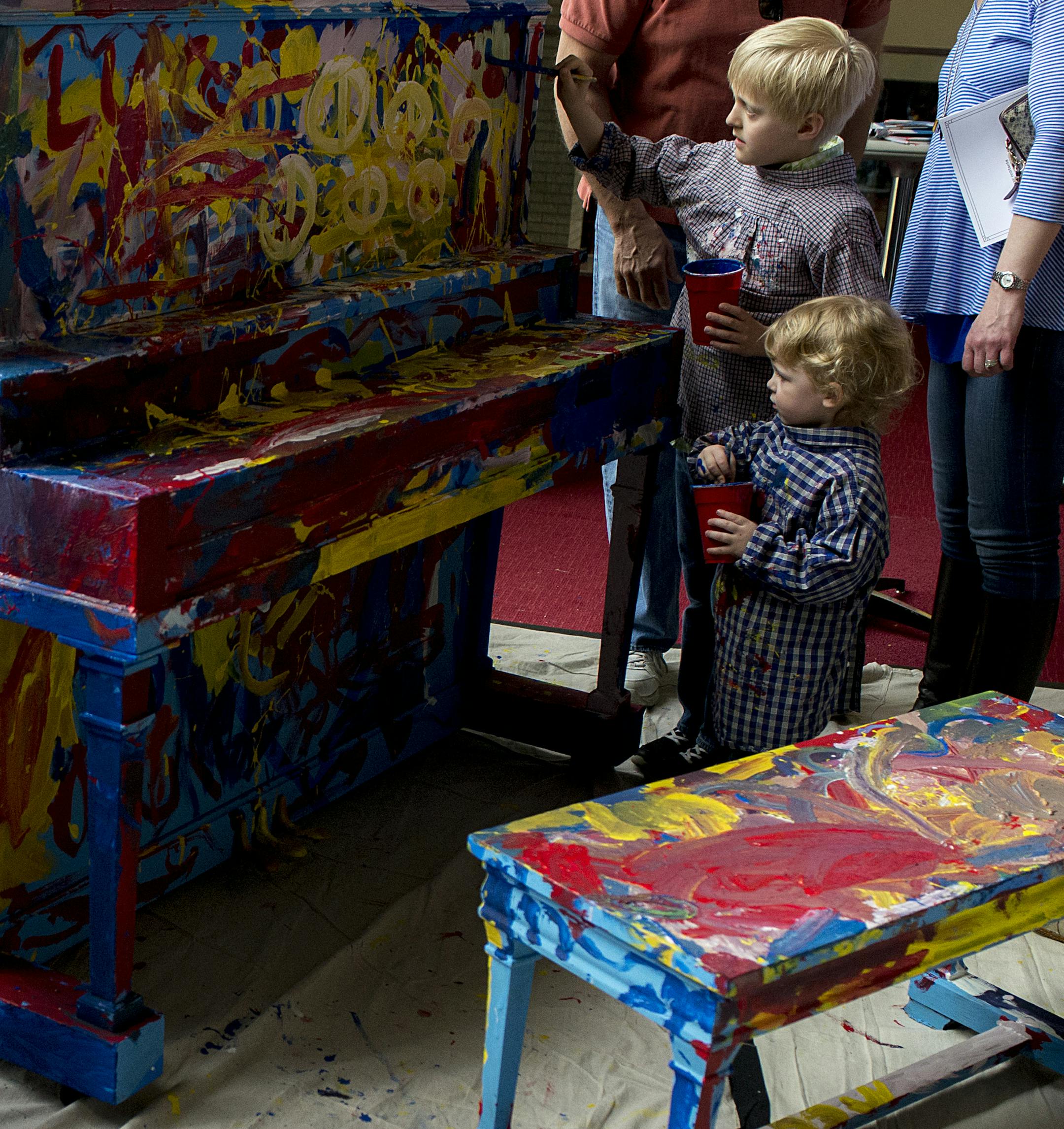 Kids paint on a piano inside the Minneapolis Institute of Arts.] BRIDGET BENNETT SPECIAL TO THE STAR TRIBUNE • bridget.bennett@startibune.com 89.3 the Current's annual event Rock the Cradle at the Minneapolis Institute of Arts on Sunday, April 12, 2015. The event had storytelling by the radio's djs, arts and craft activities, and live performances form kids-music performers like Koo Koo Kanga Roo and the Okee Dokees.