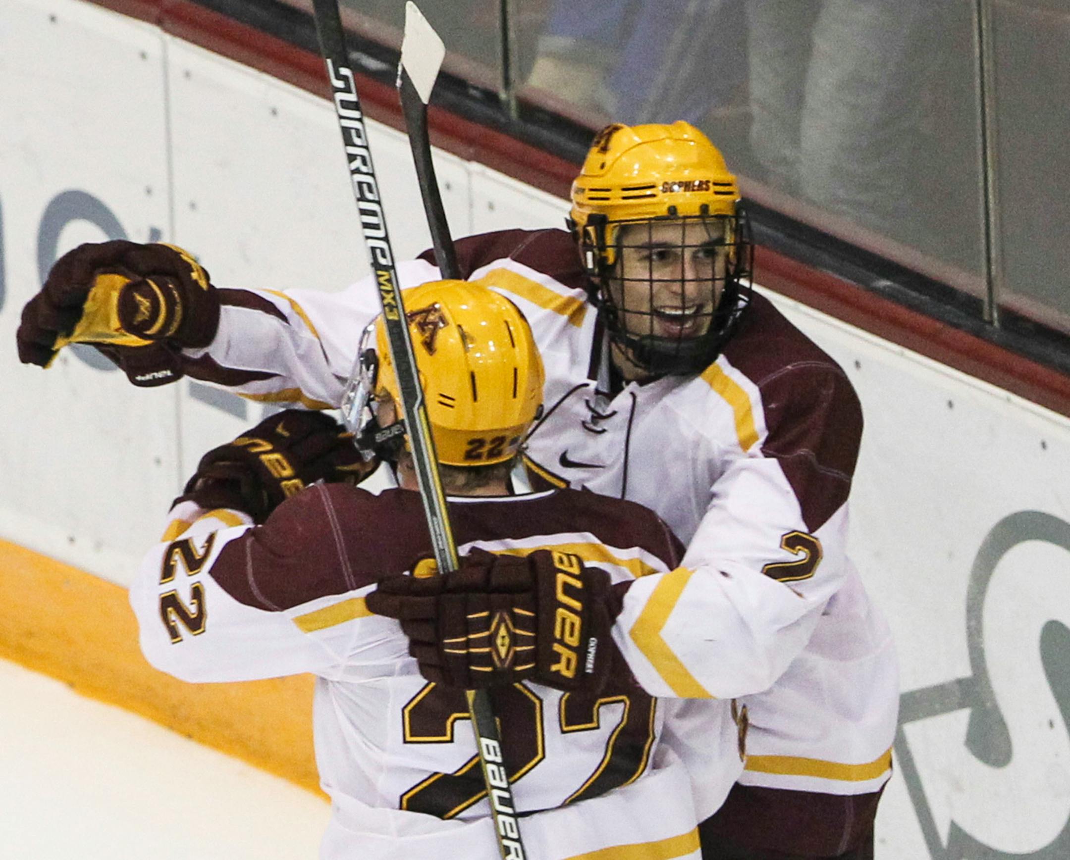Brady Skjei (2) celebrates with Travis Boyd (22) the first of Boyd's two second period goals against Bemidji State at Mariucci Arena.