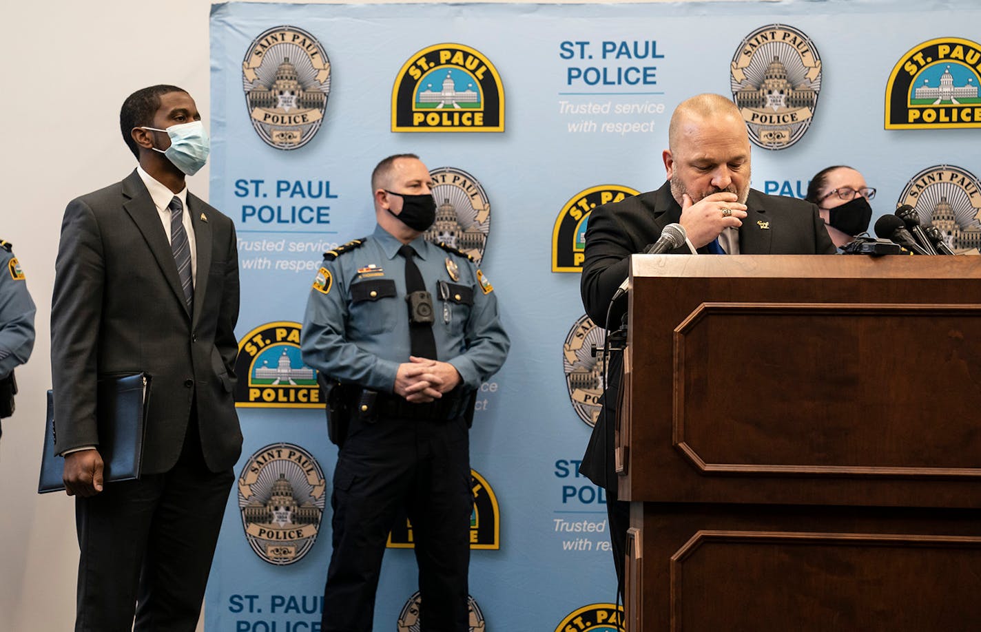 St. Paul Police Chief Todd Axtell, Mayor Melvin Carter and other officers stood at the podium as body camera footage played for the media on televisions in the room at a press conference about a shooting by a police officer last weekend in St. Paul, Minn., on Tuesday, December 1, 2020.