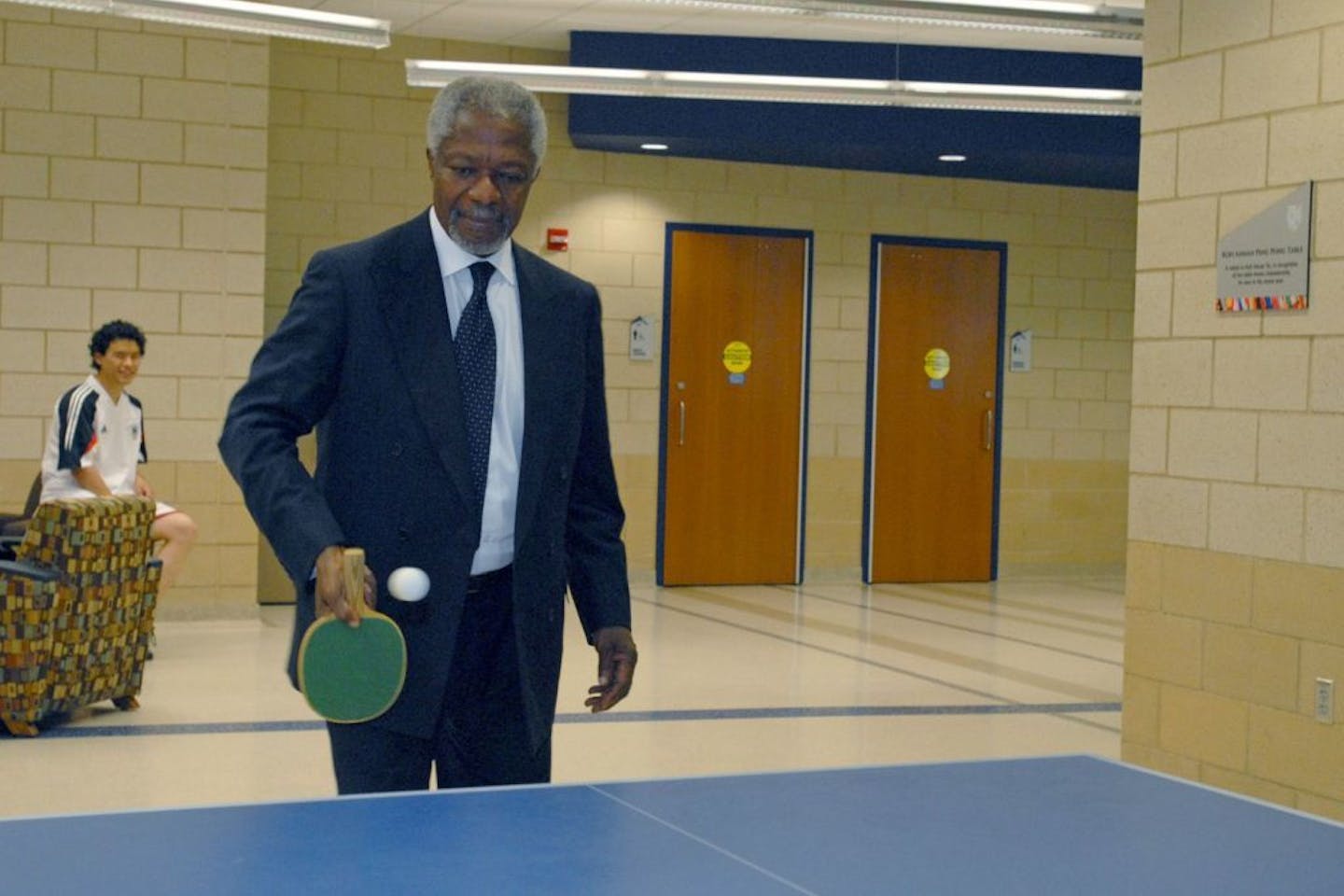 Former United Nations Secretary-General Kofi Annan tests out the ping-pong table dedicated in his honor during a 2009 visit to Macalester College.