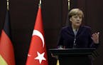 German Chancellor Angela Merkel speaks to the media during a joint news conference with Turkish Prime Minister Ahmet Davutoglu in Ankara, Turkey, Mond