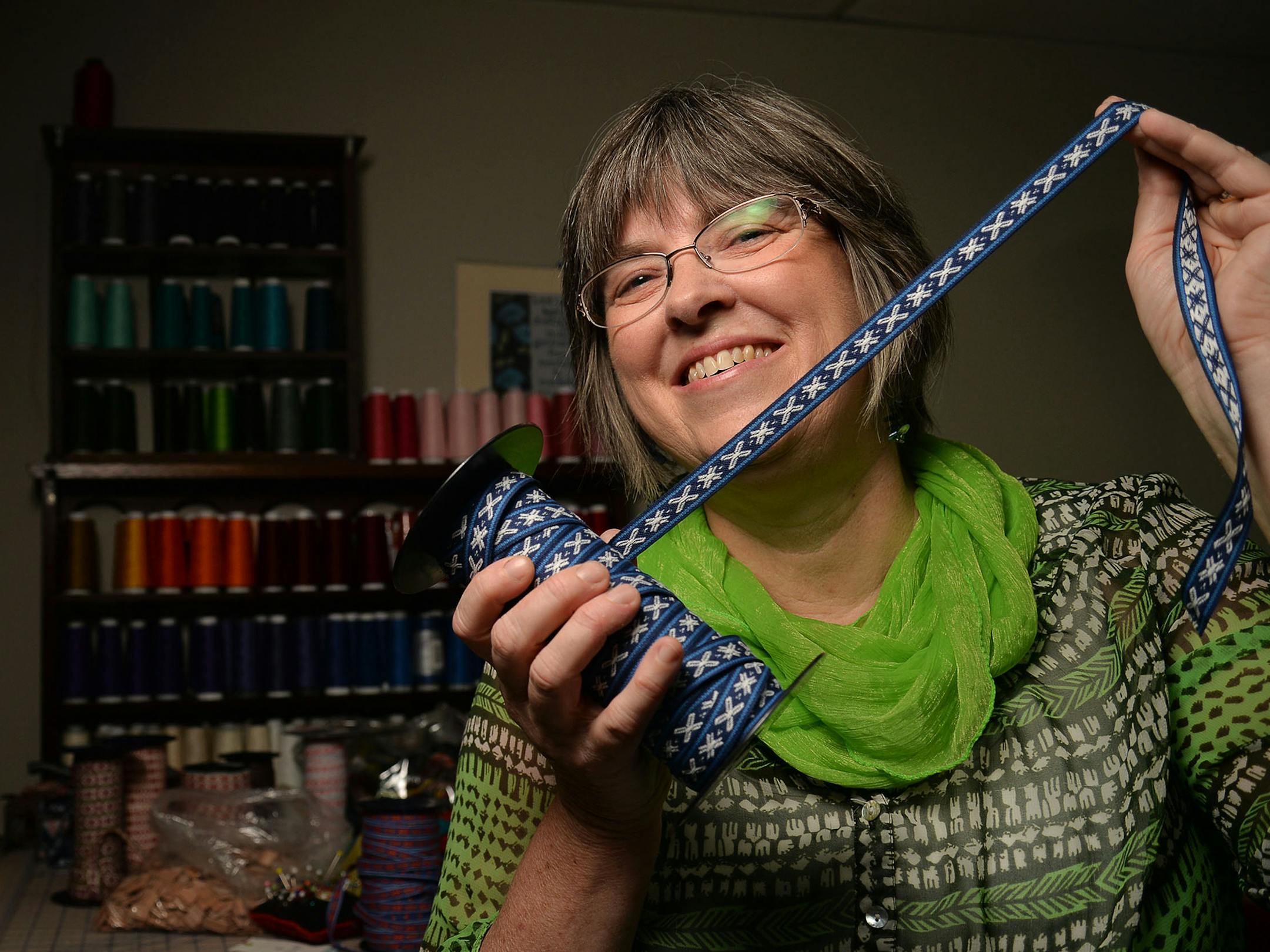 Julie Steller, the owner of Steller Handcrafted Goods, in her Minneapolis basement, where she creates mittens, coats, scarves and more by repurposing Nordic sweaters and other items.