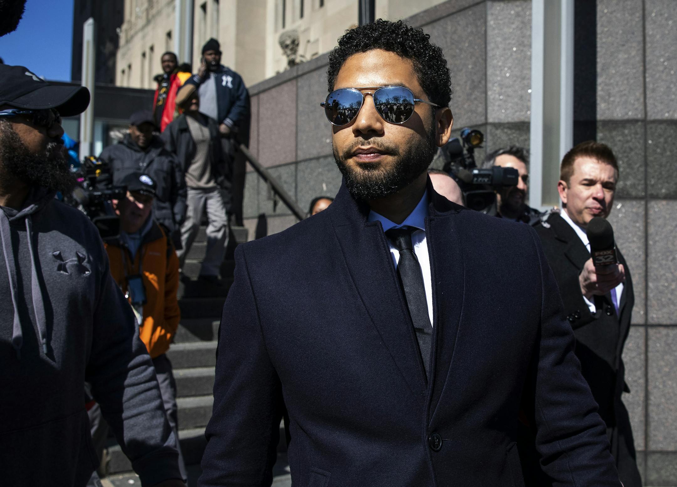FILE - In this March 26, 2019, file photo, Actor Jussie Smollett leaves the Leighton Criminal Courthouse in Chicago after prosecutors dropped all charges against him. Smollett was indicted on 16 felony counts related to making a false report that he was attacked by two men who shouted racial and homophobic slurs. (Ashlee Rezin/Chicago Sun-Times via AP, File)