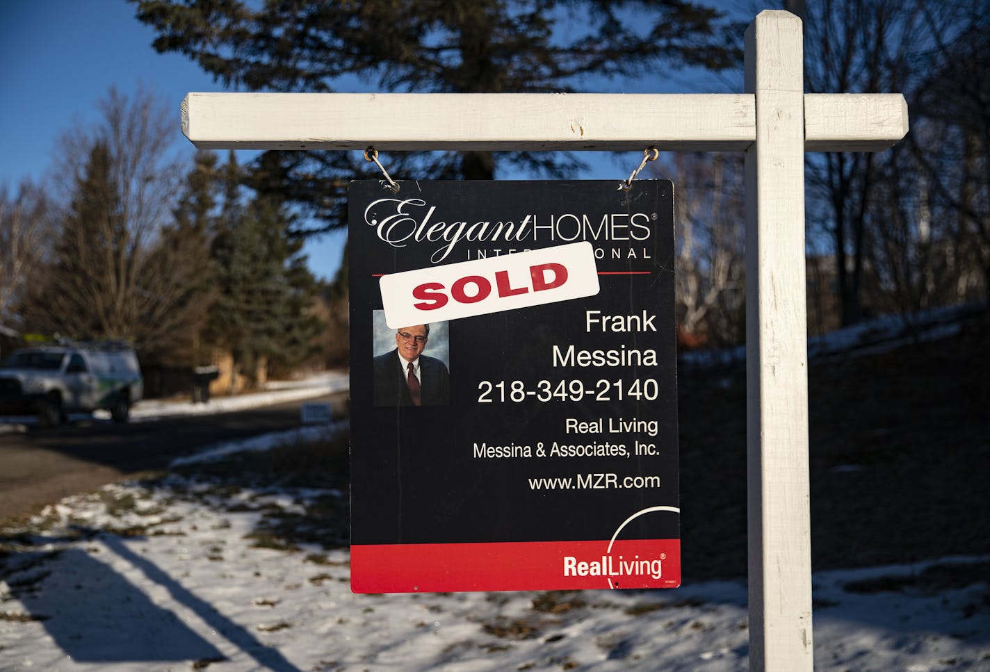 A sold sticker covered a for sale sign from Real Living Messina & Associates on Cliff Ave. in Duluth on Tuesday. Housing prices and closed sales have soared in the Duluth area this fall.