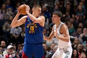 Nikola Jokic of the Nuggets and Luka Garza of the Timberwolves squared off on March 19 at Target Center.