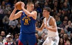 Nikola Jokic of the Nuggets and Luka Garza of the Timberwolves squared off on March 19 at Target Center.