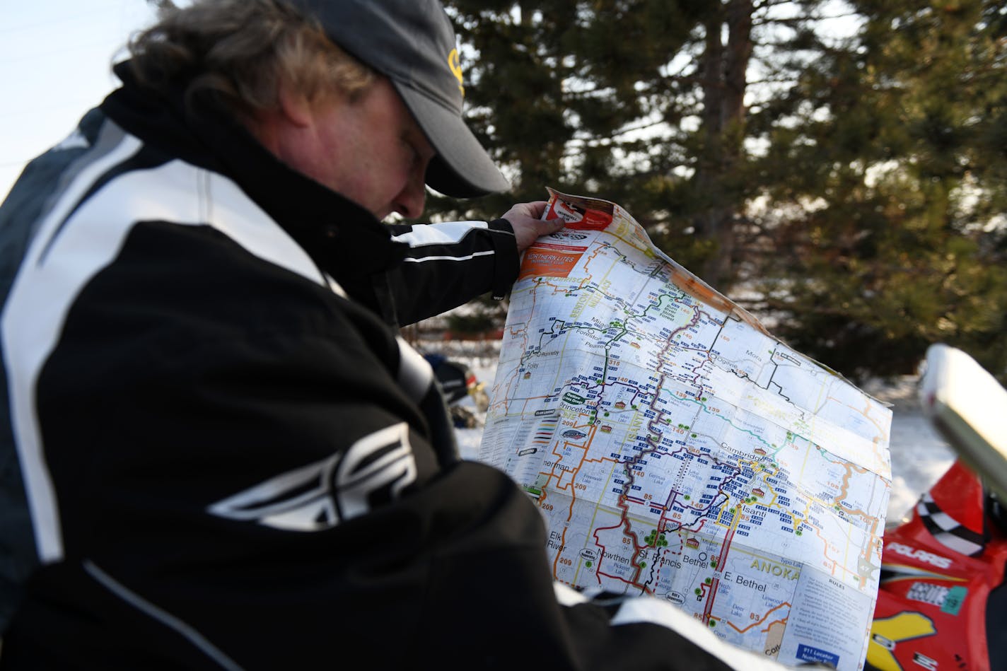 Rob Scheffler of Anoka looked at a map that showed snowmobile trails in the area. ] COURTNEY DEUTZ &#x2022; courtney.deutz@startribune.com on Friday, March 8, 2019 in Anoka Minnesota. The city of Anoka created a snowmobile corral for snowmobilers to park at while they spend time downtown Anoka.