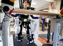 Gillette Children's Hospital physical therapist Kellen Feeney utilizes a robalt, which means robotic assisted locomotor training, to aid a young patie