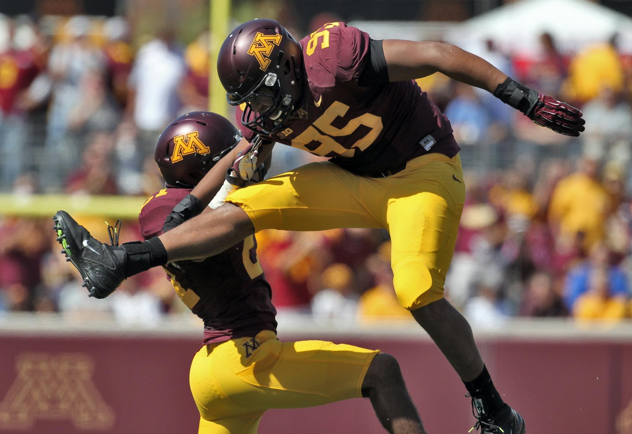 Gophers Brock Vereen, left, and D.L. Wilhite celebrated after a first half turnover caused by the Gophers defense.