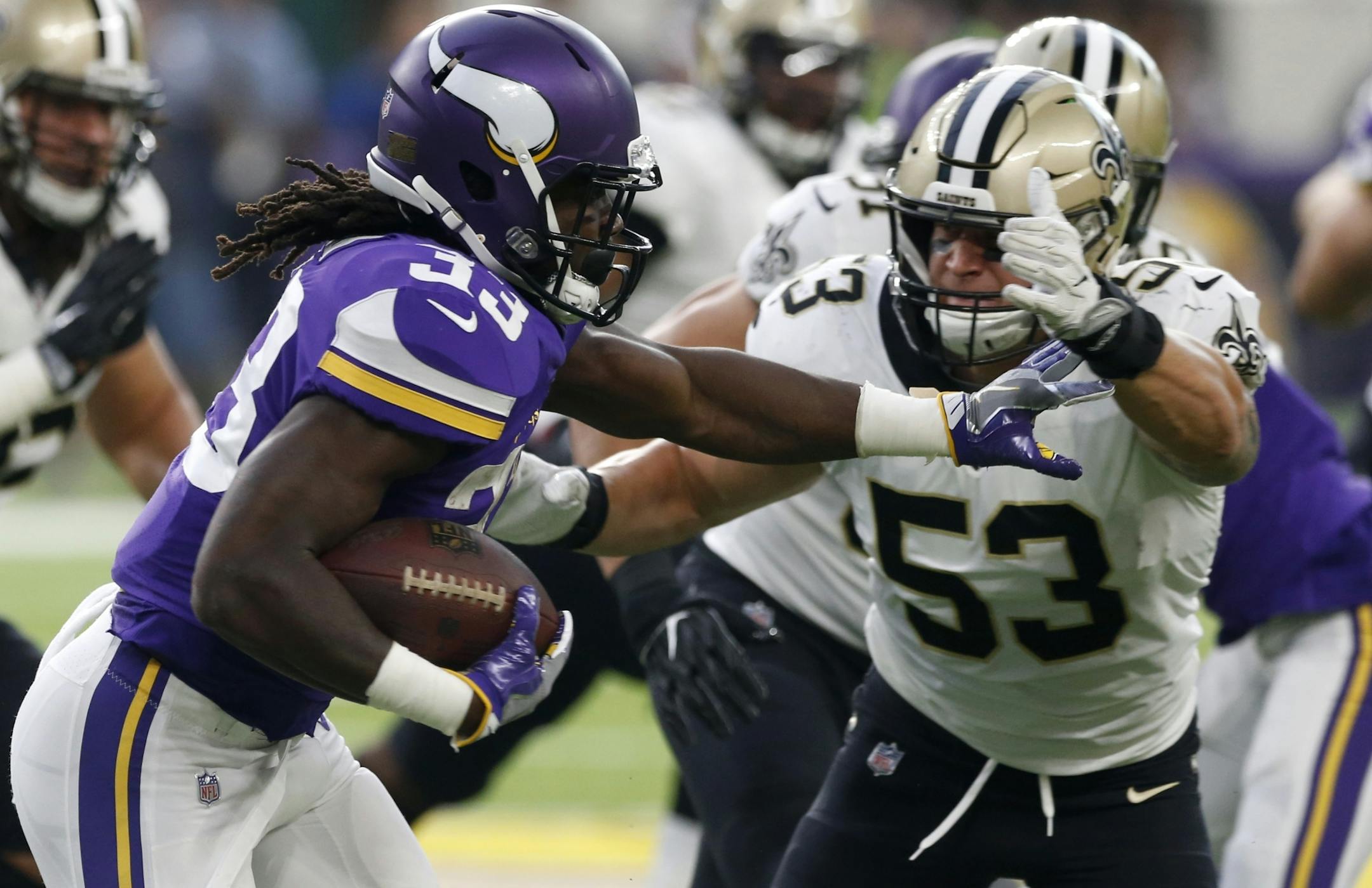 Minnesota Vikings running back Dalvin Cook, left, runs from New Orleans Saints linebacker A.J. Klein (53) during the first half of an NFL football game, Monday, Sept. 11, 2017, in Minneapolis.