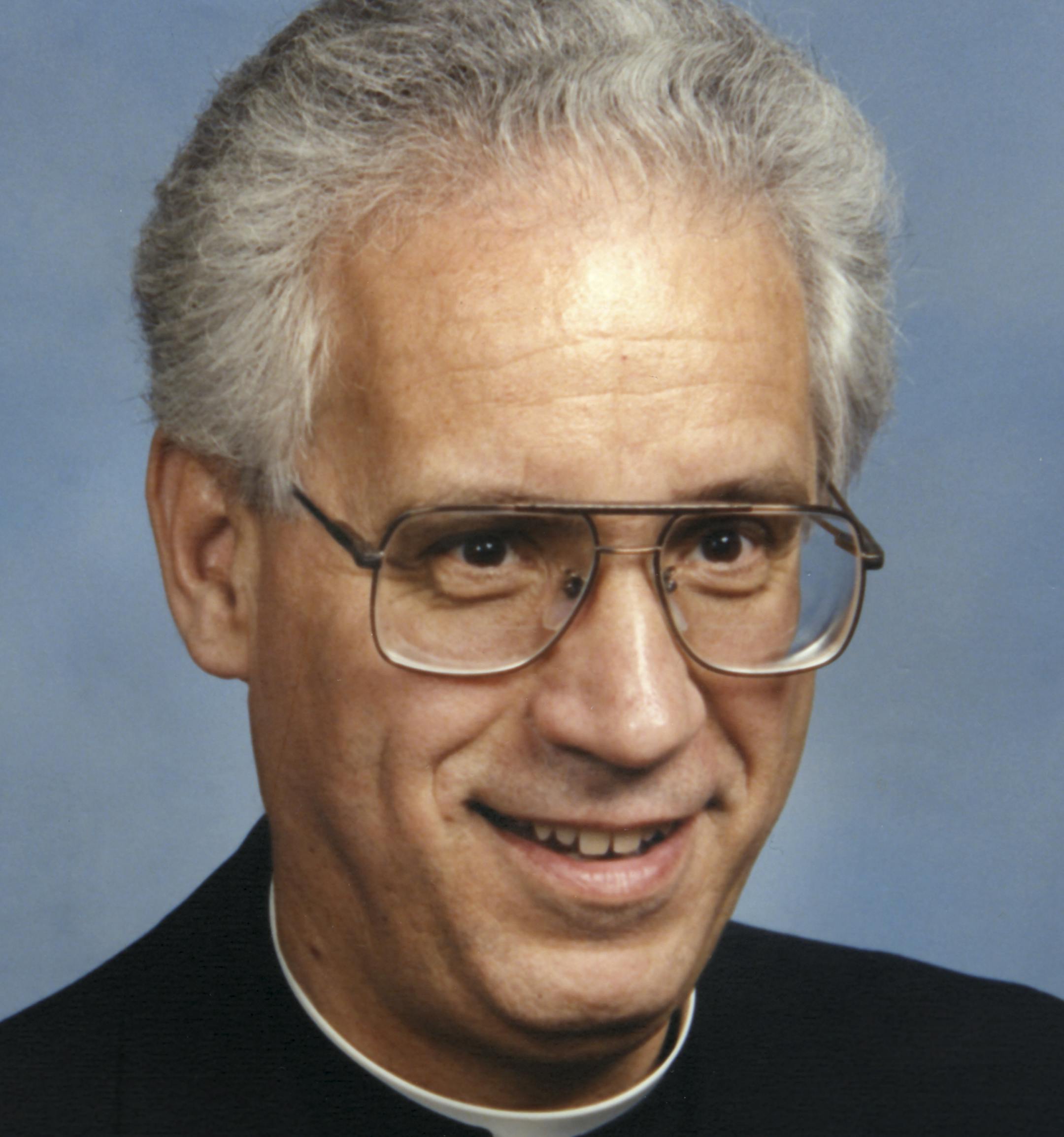 Father Charles Froehle who was a professor, dean and rector at the St. Paul Seminary School of Divinity. Scanned on January 13, 2015. Original print by Olan Mills Studio in 1989.