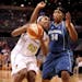 PHOENIX - JULY 22: Cappie Pondexter #23 of the Phoenix Mercury drives with the ball past Tasha Humphrey #34 of the Minnesota Lynx during the WNBA game