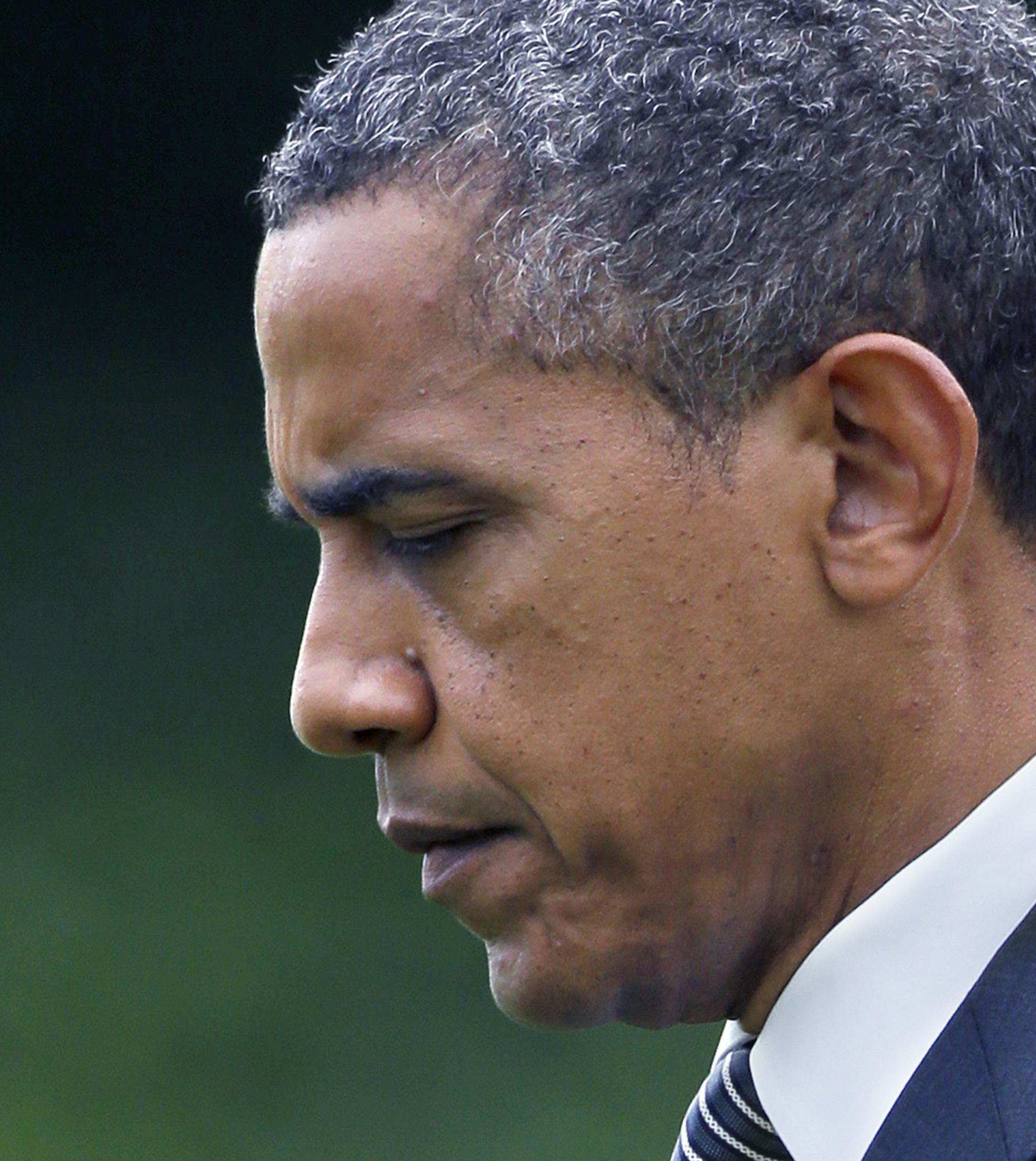 President Barack Obama walks from the Oval office to Marine One on the South Lawn of the White House in Washington, Friday, Sept. 14, 2012, heading to Andrews Air Force Base, Md. to attend the transfer of remains ceremony marking the return to the United States of the remains of the four Americans killed this week in Benghazi, Libya. (AP Photo/Pablo Martinez Monsivais) ORG XMIT: MIN2012091414024683