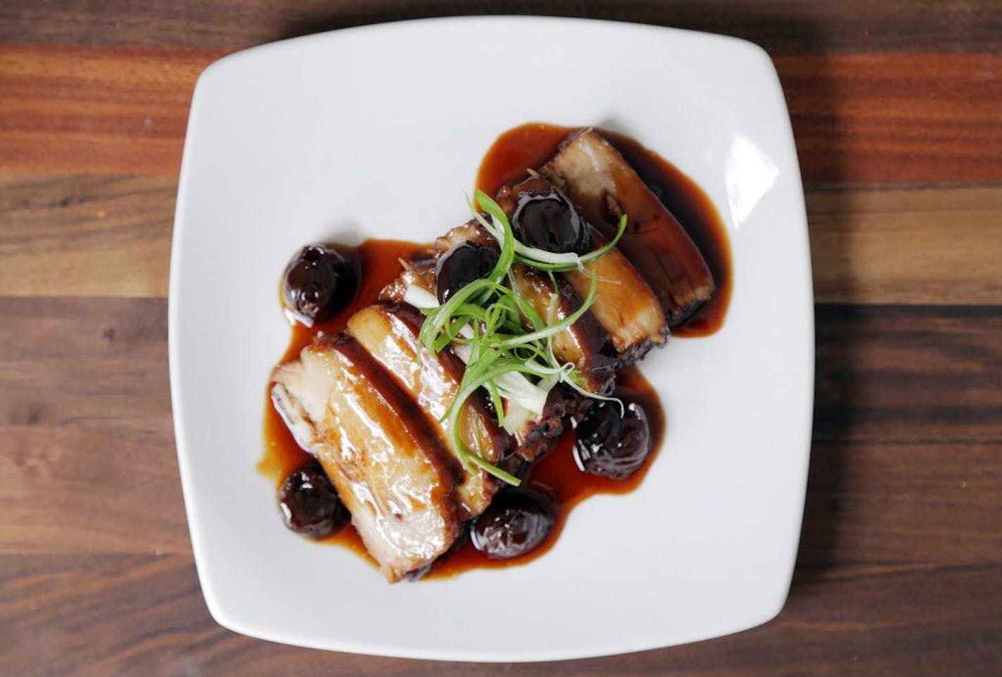 Madeleine Hill Twice-cooked Red Pork Belly with Cherries at Andrew Zimmern's new restaurant, Lucky Cricket.