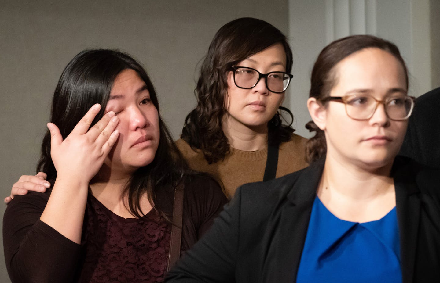 M.K. Nguyen hugged friend Jennifer Nguyen-Moore as Nguyen-Moore wiped away tears during the press conference. ] GLEN STUBBE &#x2022; glen.stubbe@startribune.com Thursday, December 20, 2018 St. Paul Mayor Melvin Carter along with state representatives Carlos Mariani and Kaohly Her hold a news conference to condemn deportation of Southeast Asian Americans. This could be the B display. Hoang Murphy, a community member, will be there.