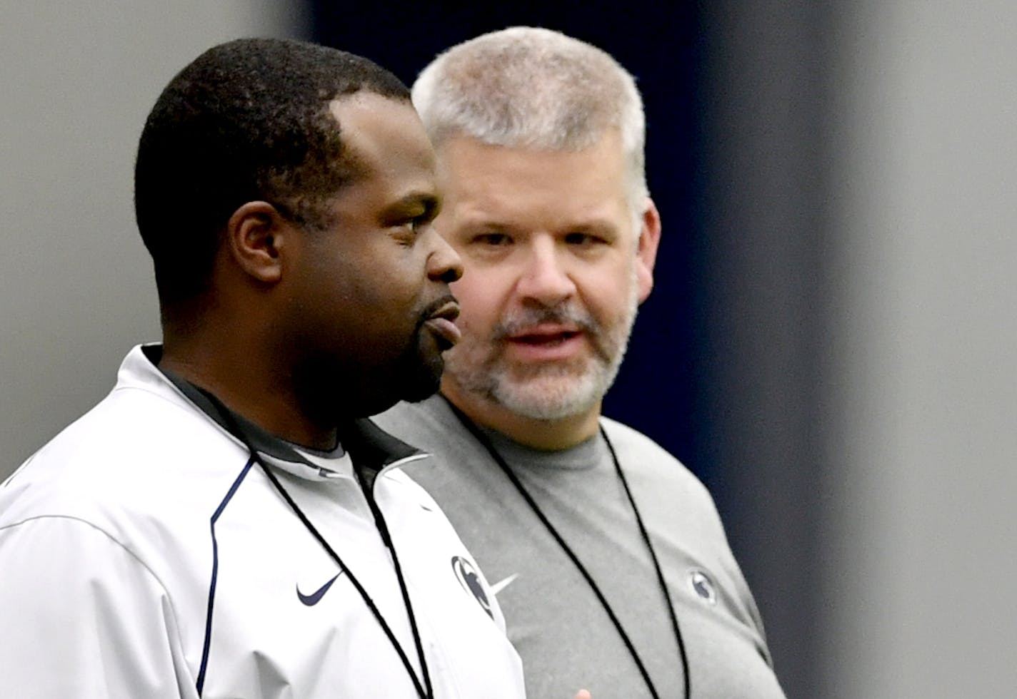 Penn State running backs coach and special teams coordinator Charles Huff, left, and offensive line coach Matt Limegrover talk during the NCAA college football team's practice, Wednesday, Aug. 24, 2016, in State College, Pa. (Abby Drey/Centre Daily Times via AP)