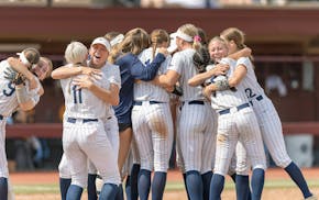 Champlin Park players celebrate their 6-0 win over Bloomington Jefferson in the Class 4A softball state championship game at Jane Sage Cowles Stadium