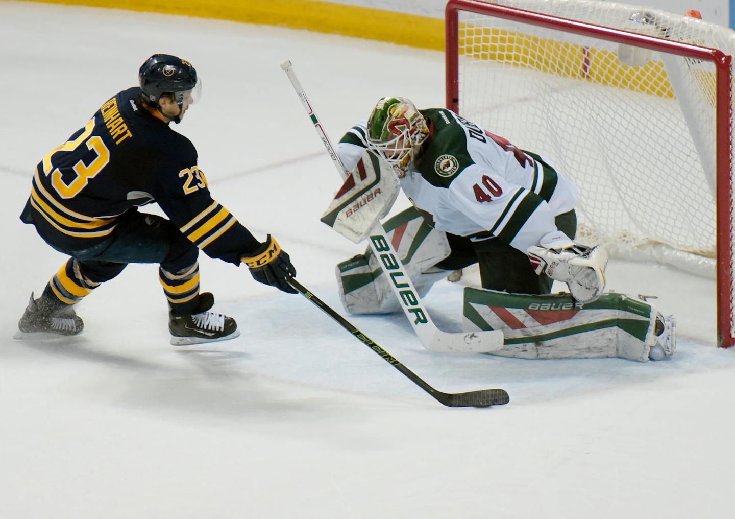 Buffalo Sabres center Sam Reinhart (23) moves in to shoot on Minnesota Wild goaltender Devan Dubnyk (40) during a shootout of an NHL hockey game, Saturday, March 5, 2016, in Buffalo, N.Y. Minnesota won 3-2 in a shootout. (AP Photo/Gary Wiepert)