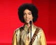 In this Nov. 22 photo, Prince presented the award for Favorite Album for Soul/R&B at the American Music Awards in Los Angeles.