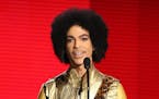 In this Nov. 22 photo, Prince presented the award for Favorite Album for Soul/R&B at the American Music Awards in Los Angeles.
