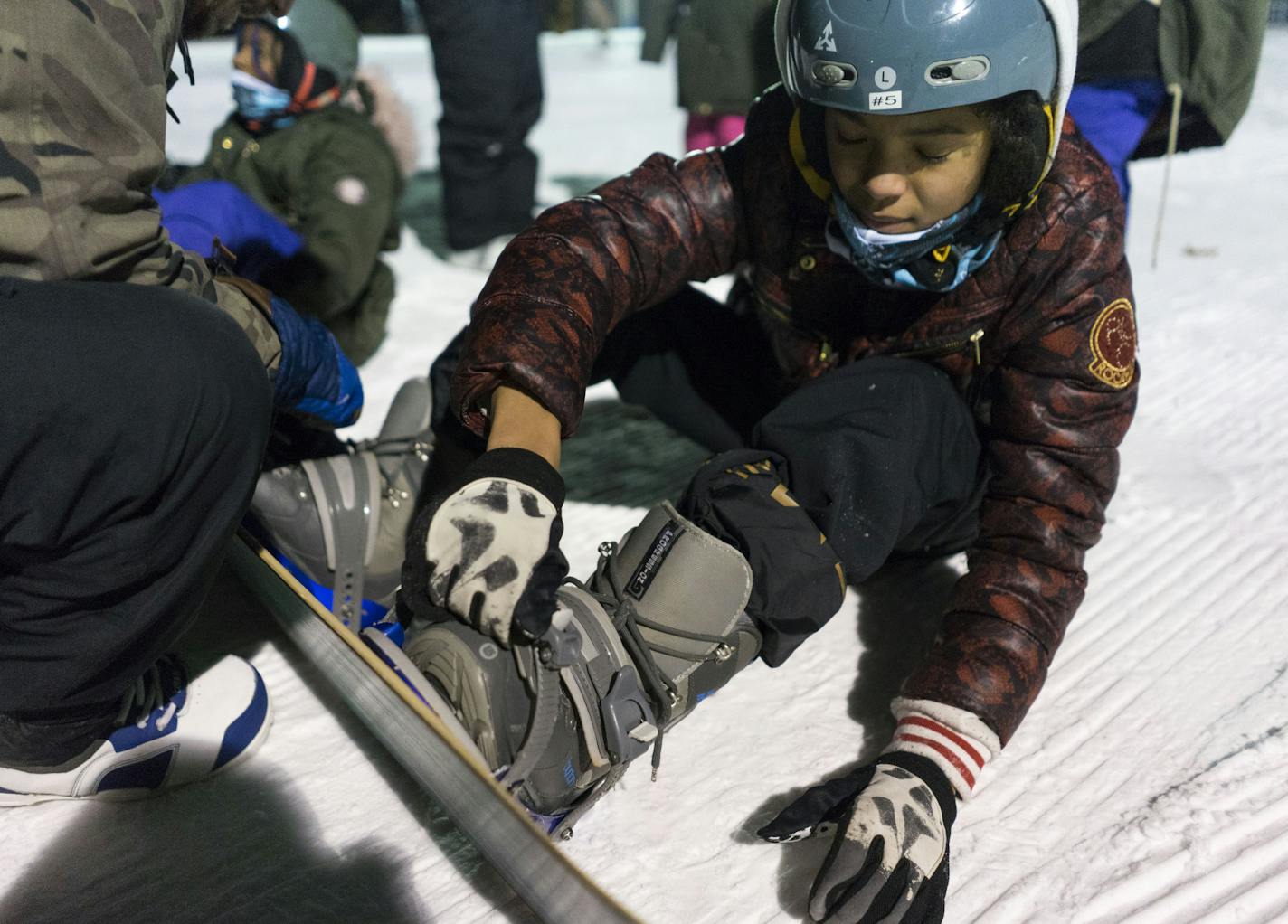 Na'Vayaiah Manciel, 11 straps her boots into her snowboard at Theodore Wirth Park in Minneapolis on Thursday, Feb. 14 2019. ]
TONY SAUNDERS &#xb0; anthony.saunders@startribune.com Today was the first day many of the kids had ever snowboarded.