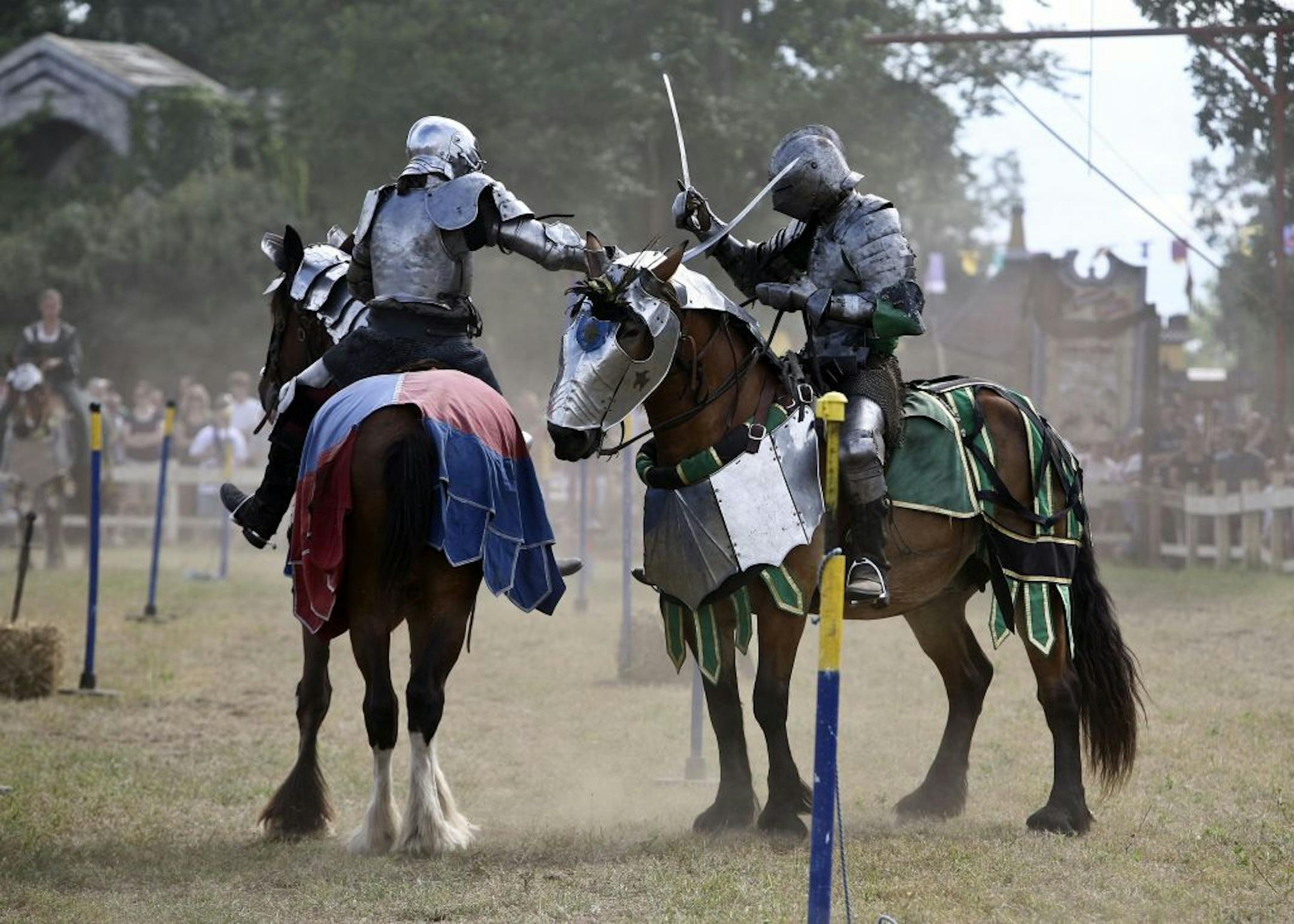 Knights Sam Kuecker , right, and Douglass Payne took wipes at each other with swords during the afternoon show the first day of the 41st annual Renaissance Festival in Shakopee.
