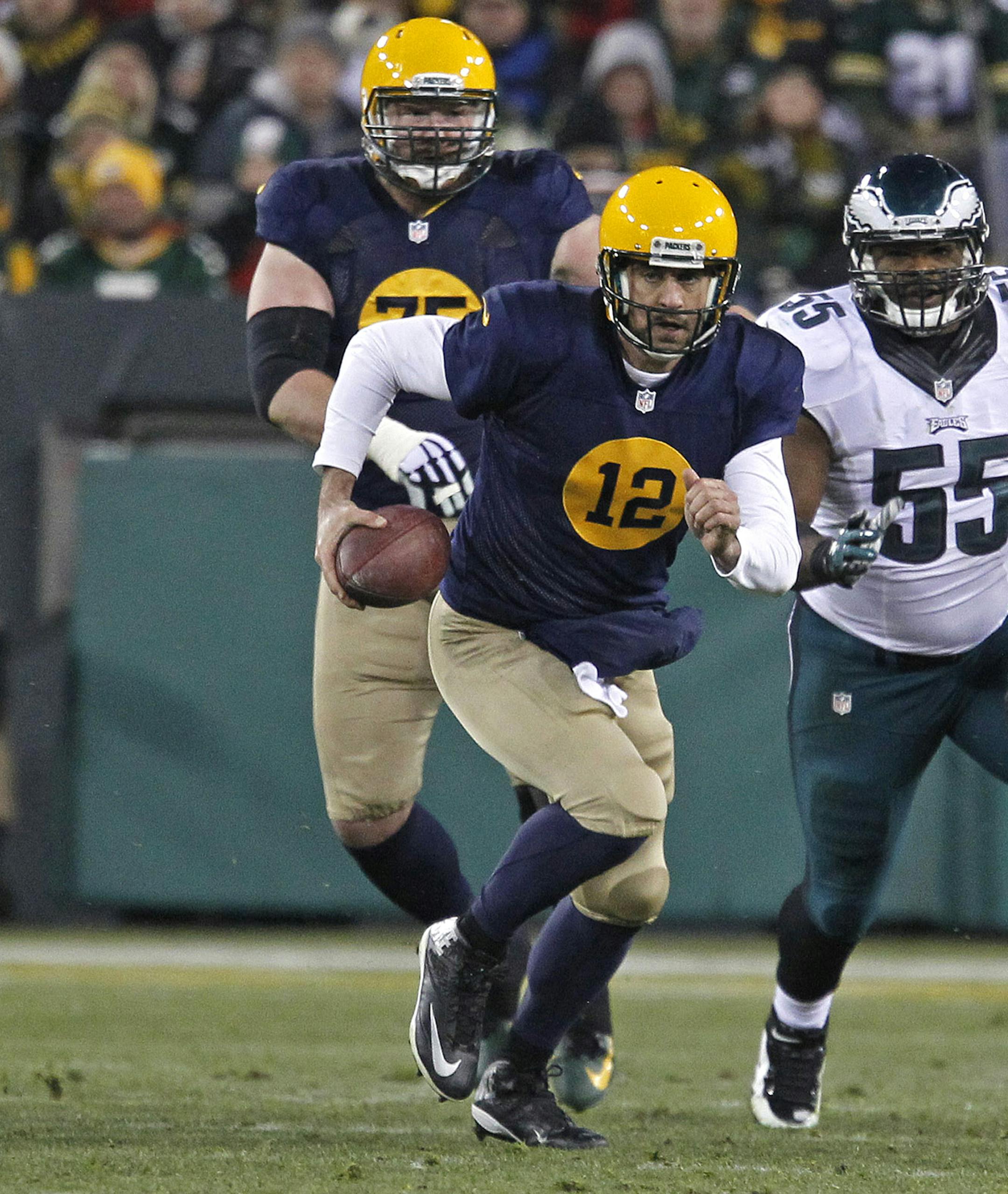 Green Bay Packers quarterback Aaron Rodgers (12) in action against the Philadelphia Eagles during an NFL football game Sunday Nov. 16, 2014, in Green Bay, Wis. (AP Photo/Matt Ludtke)