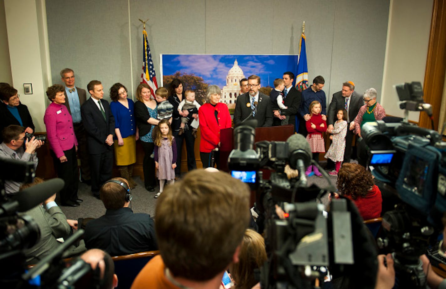 Surrounded by same-sex couples and their children, Senator Scott Dibble and Rep. Karen Clark introduced their bill to legalize same-sex marriages in Minnesota. Wednesday, February 27, 2013.    ]   GLEN STUBBE * gstubbe@startribune.com