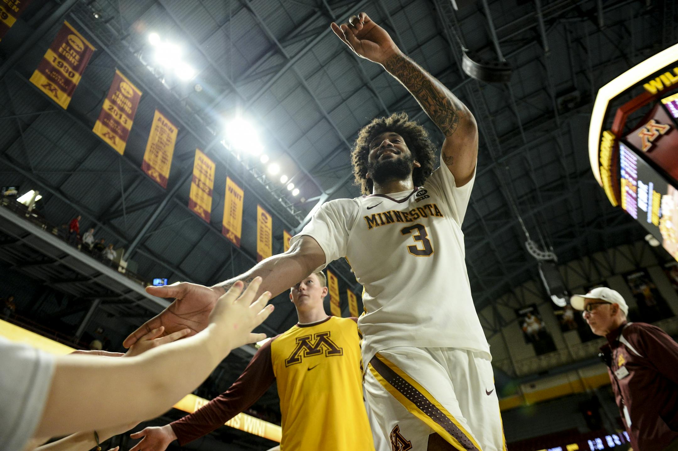 Minnesota Golden Gophers forward Jordan Murphy (3) acknowledged fans after his team's win against the Illinois Fighting Illini.