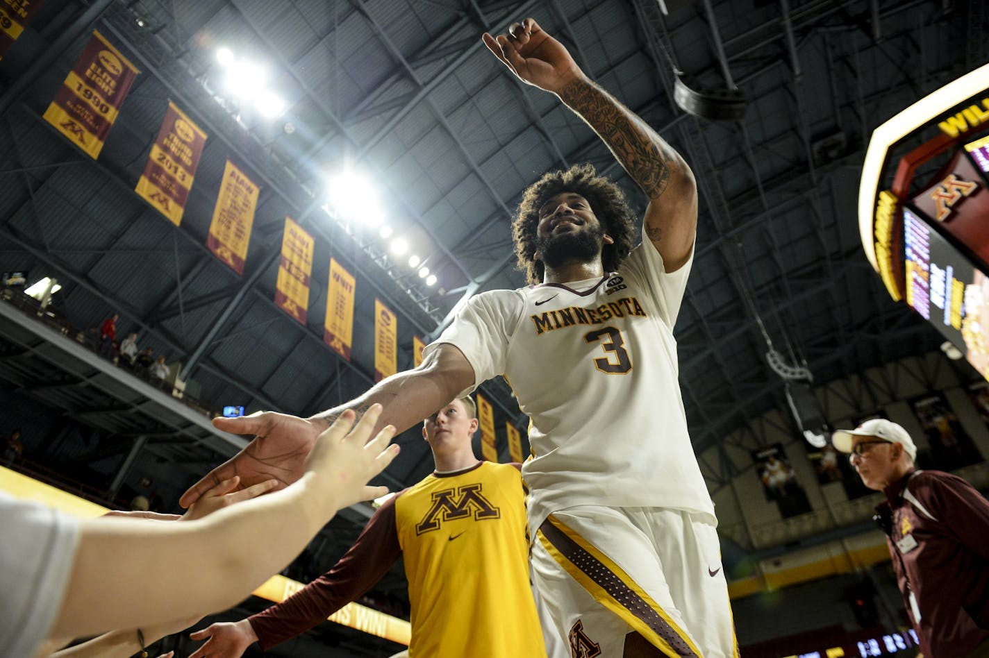 Minnesota Golden Gophers forward Jordan Murphy (3) acknowledged fans after his team's win against the Illinois Fighting Illini.