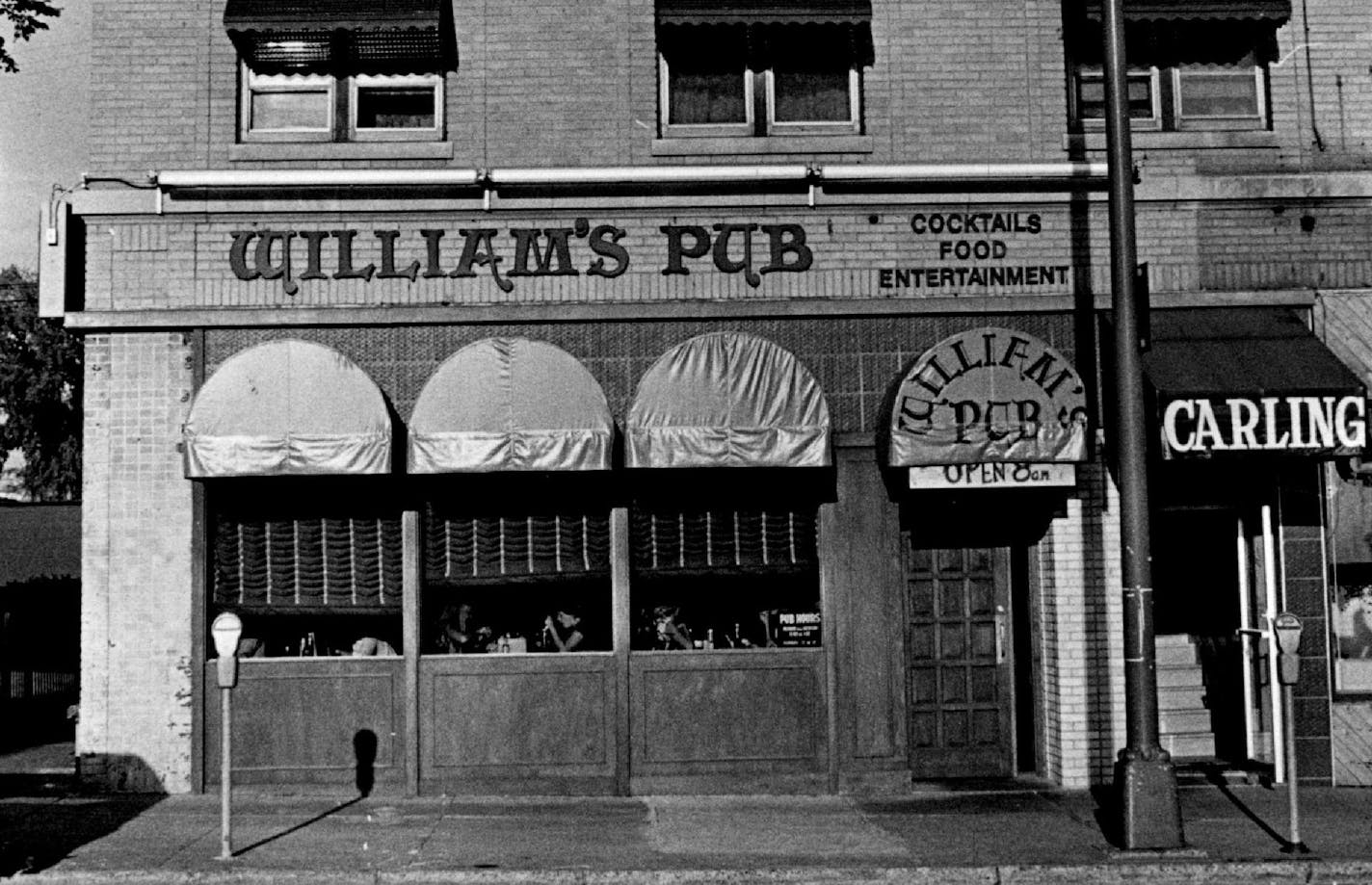 August 13, 1976 William's Pub at 2907 Hennepin Av. Since it was remodeled early last year, William's Pub has built a reputation and a regular clientele. William's, 2907 Hennepin Av., has become a popular night spot for the 18-to-30 working crowd in the Uptown area. The bar attracts people in stylish gauze shirts and fancy jeans and peers in T-shirts and well-worn blue jeans. There's invariably a wait to be seated on nights and it's often difficult to find a table on week nights. August 10, 1976 Tom Sweeney, Minneapolis Star Tribune