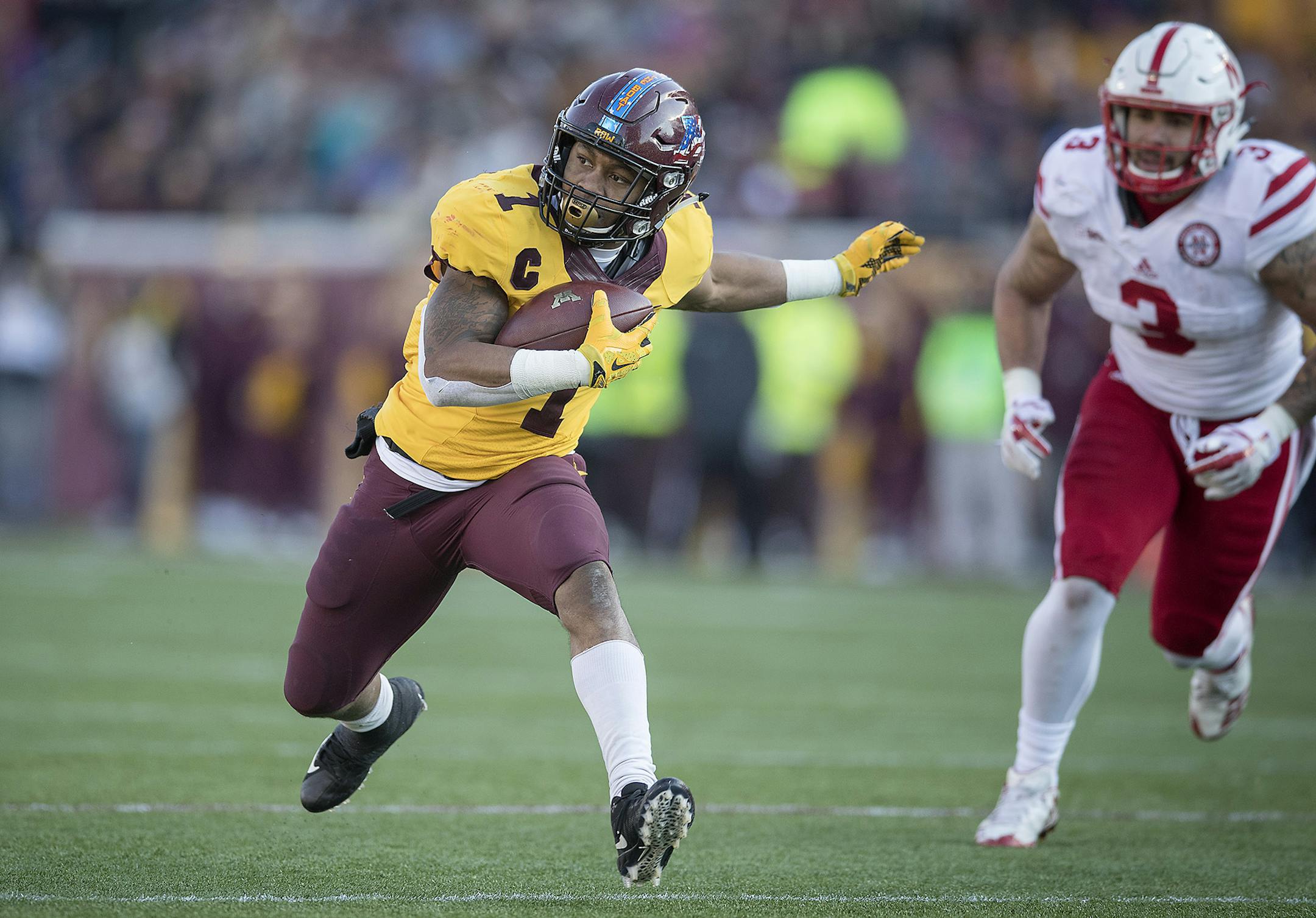 Minnesota's running back Rodney Smith rushed with the ball chased by Nebraska's linebacker Marcus Newby during the third quarter as the Gophers took on Nebraska, Saturday, November 11, 2017 at TCF Bank Stadium in Minneapolis, MN. ] ELIZABETH FLORES ï liz.flores@startribune.com