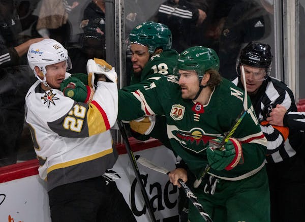 Minnesota Wild left wing Marcus Foligno (17) connected with a right to the jaw of Vegas Golden Knights defenseman Nick Holden (22) in the third period