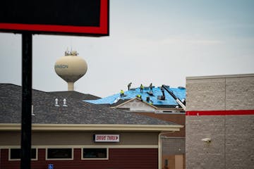 Crews installed a roof on a new apartment complex under construction in Hutchinson, Highfield Apartments.