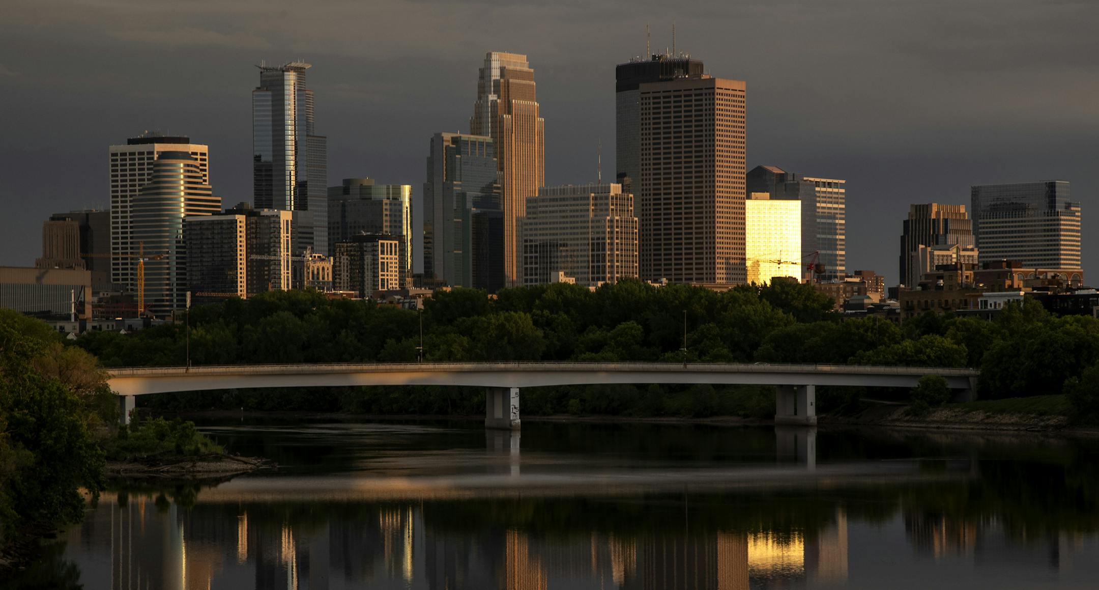 Dusk settled over downtown Minneapolis on Tuesday. ] CARLOS GONZALEZ • cgonzalez@startribune.com – Minneapolis, MN – June 2, 2020, Police Protest - man died after a confrontation with Minneapolis on Monday evening. A bystander video that started circulating sometime after the incident appeared to show the man pleading with officers that he couldn't breathe - George Floyd