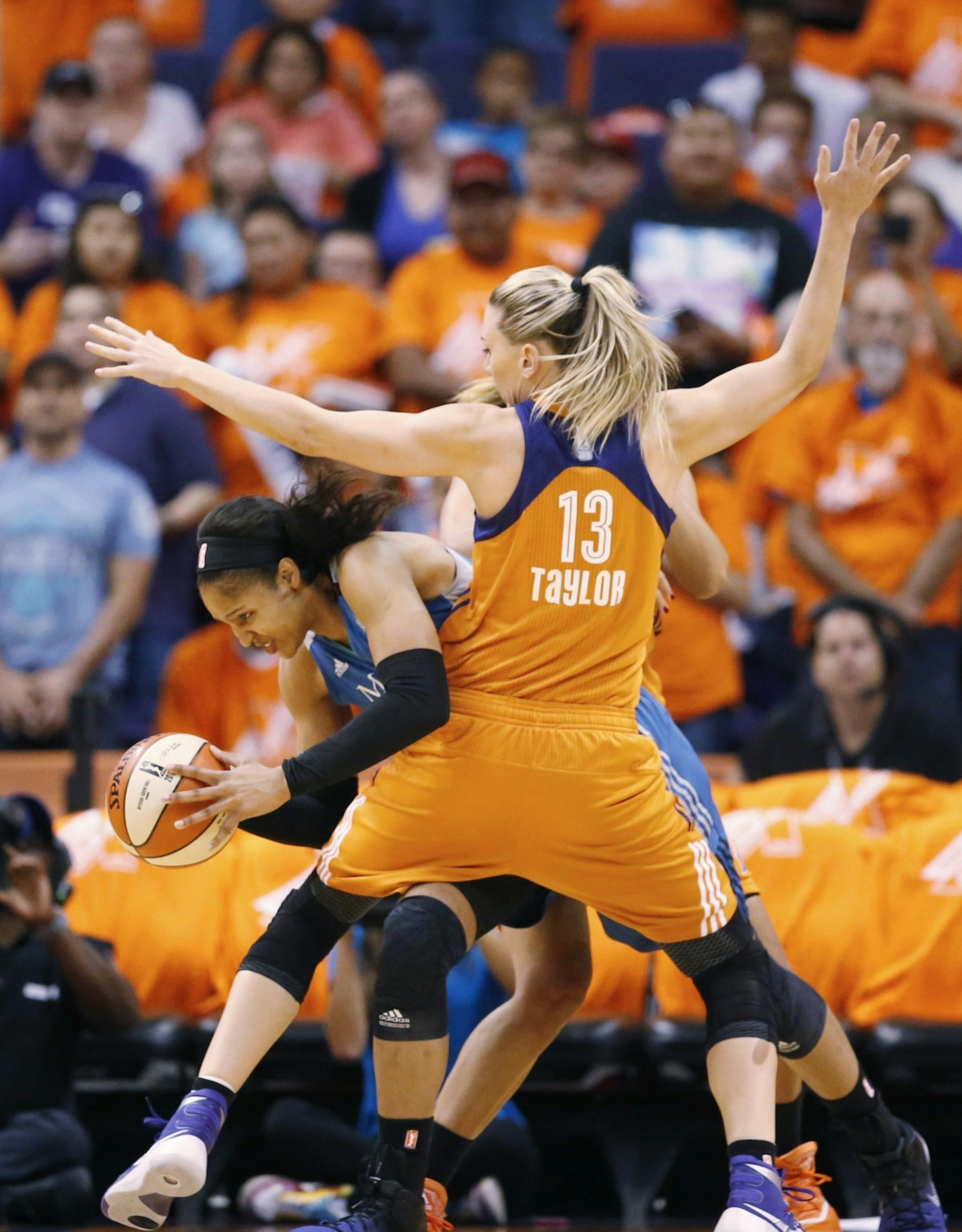 Phoenix Mercury forward Penny Taylor (13) guards Minnesota Lynx forward Maya Moore during game 3 of the WNBA basketball semifinals in Scottsdale, Ariz., Sunday, Oct. 2, 2016.