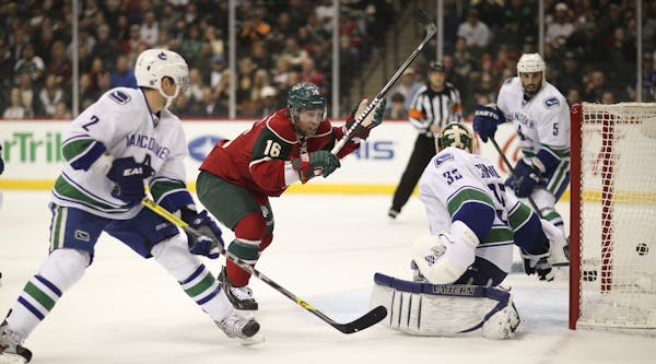 Jason Zucker celebrated his first-period goal Sunday night after the Wild rookie forward poked the puck past Vancouver goalie Cory Schneider.