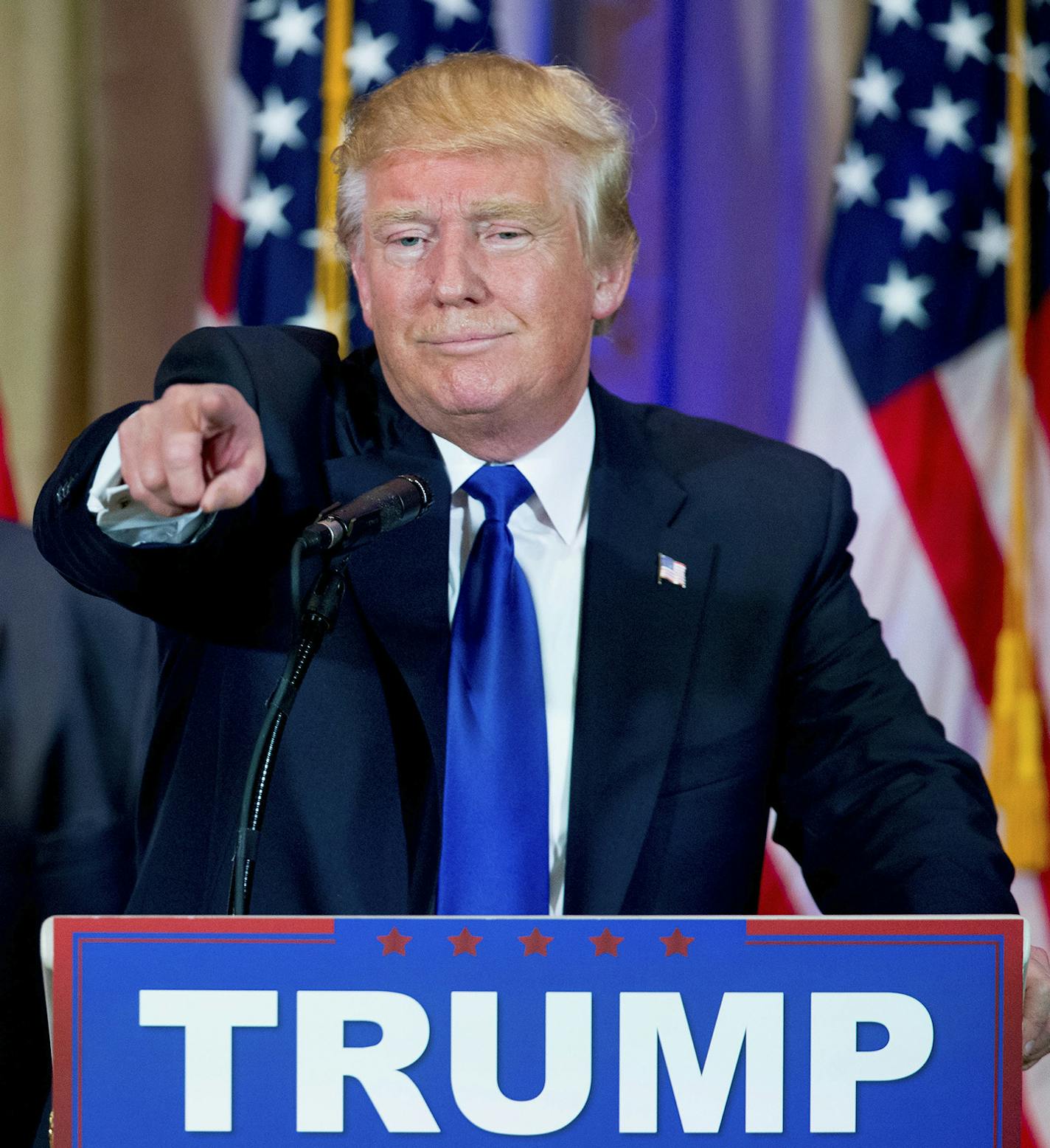 Republican presidential candidate Donald Trump, accompanied by New Jersey Gov. Chris Christie, left, takes questions from members of the media during a news conference on Super Tuesday primary election night in the White and Gold Ballroom at The Mar-A-Lago Club in Palm Beach, Fla., Tuesday, March 1, 2016. (AP Photo/Andrew Harnik) ORG XMIT: MIN2016030213164839