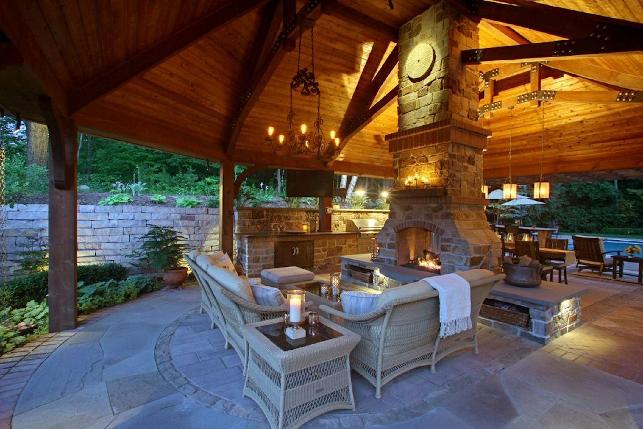 A pair of antique Korean millstones accent the top of the fireplace on both sides.
