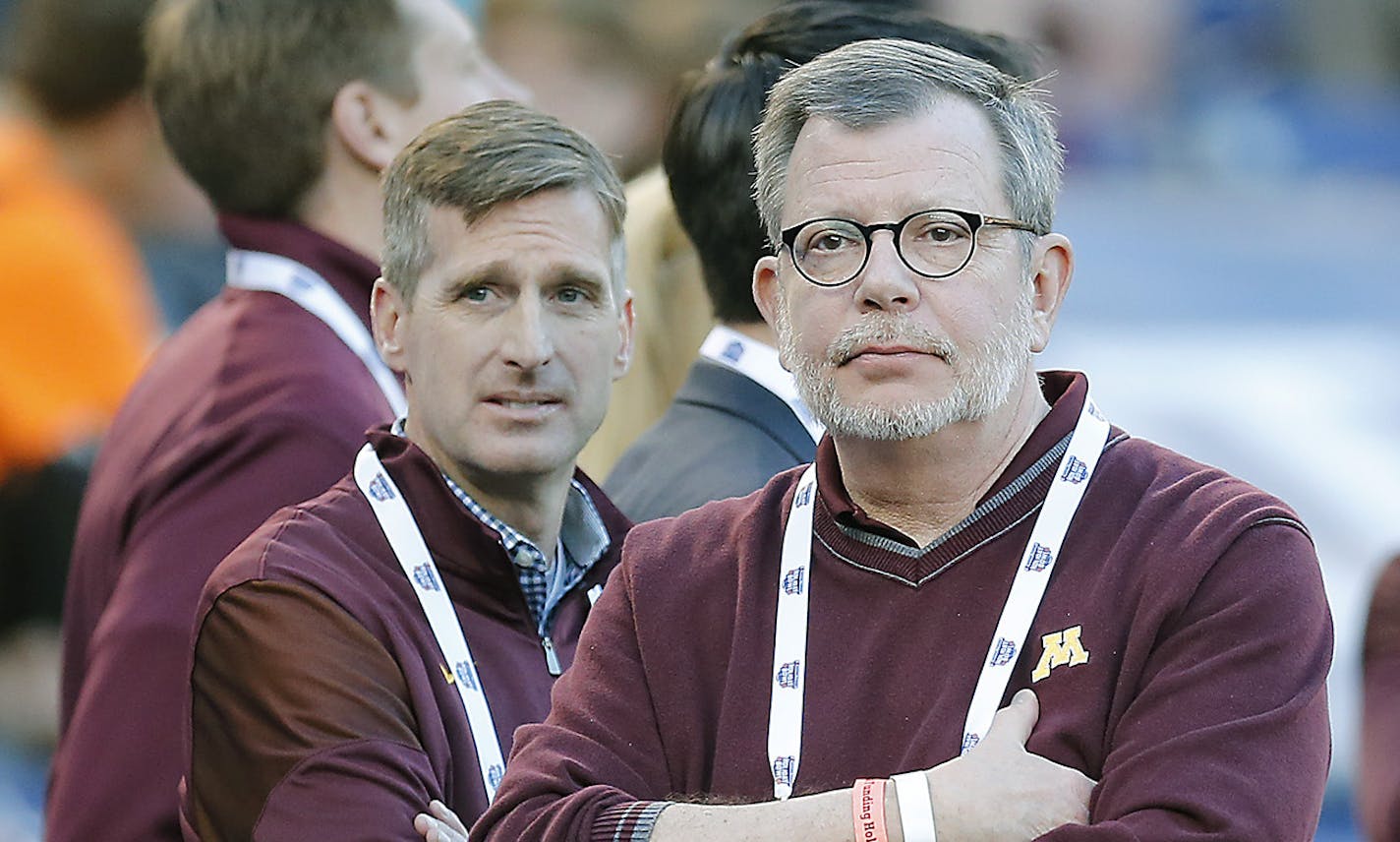 University of Minnesota President Eric Kaler, center, and Director of Athletics Mark Coyle, left, watched the game from the sidelines as Minnesota took on Washington State at Qualcomm Stadium for the San Diego Holiday Bowl, Tuesday, December 27, 2016 in San Diego, CA. ] (ELIZABETH FLORES/STAR TRIBUNE) ELIZABETH FLORES &#x2022; eflores@startribune.com