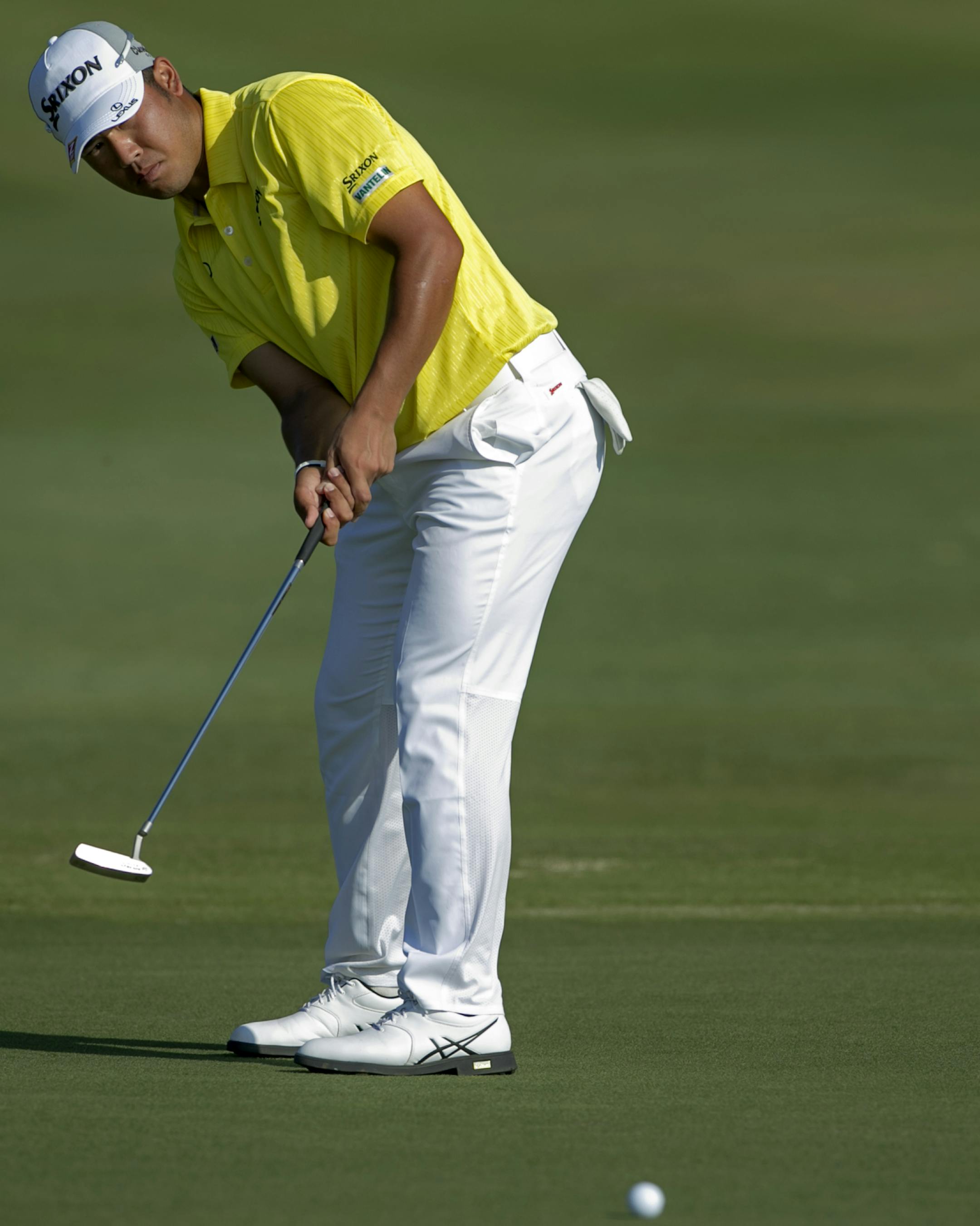 Hideki Matsuyama, of Japan, putts on the 17th green during the third round of the Tournament of Champions golf tournament, Sunday, Jan. 11, 2015, in Kapalua, Hawaii. (AP Photo/Marco Garcia)