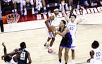 Orlando Magic's Jalen Suggs looks to shoot in front of Golden State Warriors' Jaquori McLaughlin (40) during the second half of an NBA summer league b