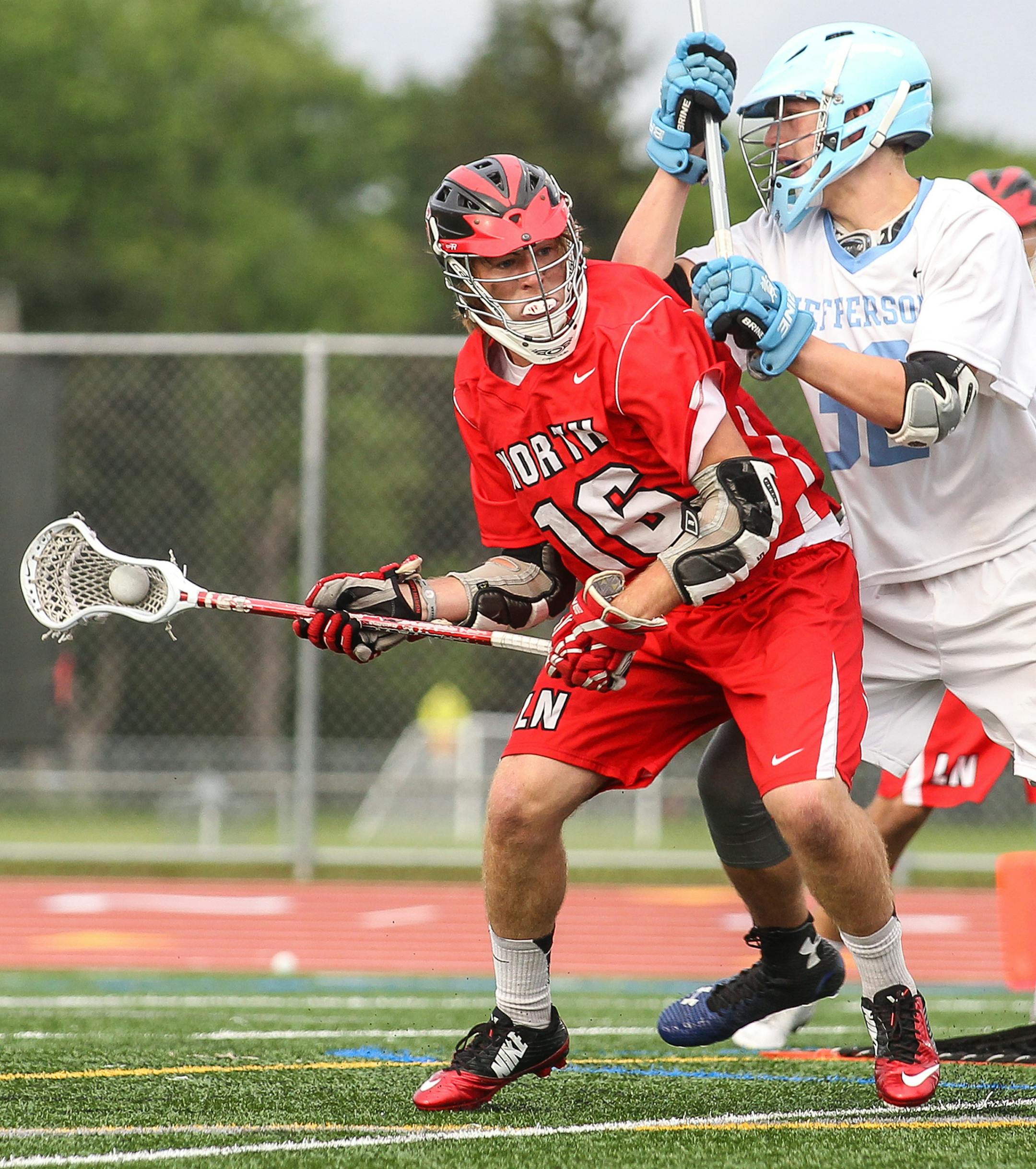 Max Johnson (16) looks for a path around Bloomington Jefferson defender Alexander Wilson in a boys' lacross state tournament semifinal on Thursday, June 11, 2015. Johnson, a junior, scored 20 goals for Lakeville North in 2015. Photo by Mark Hvidsten