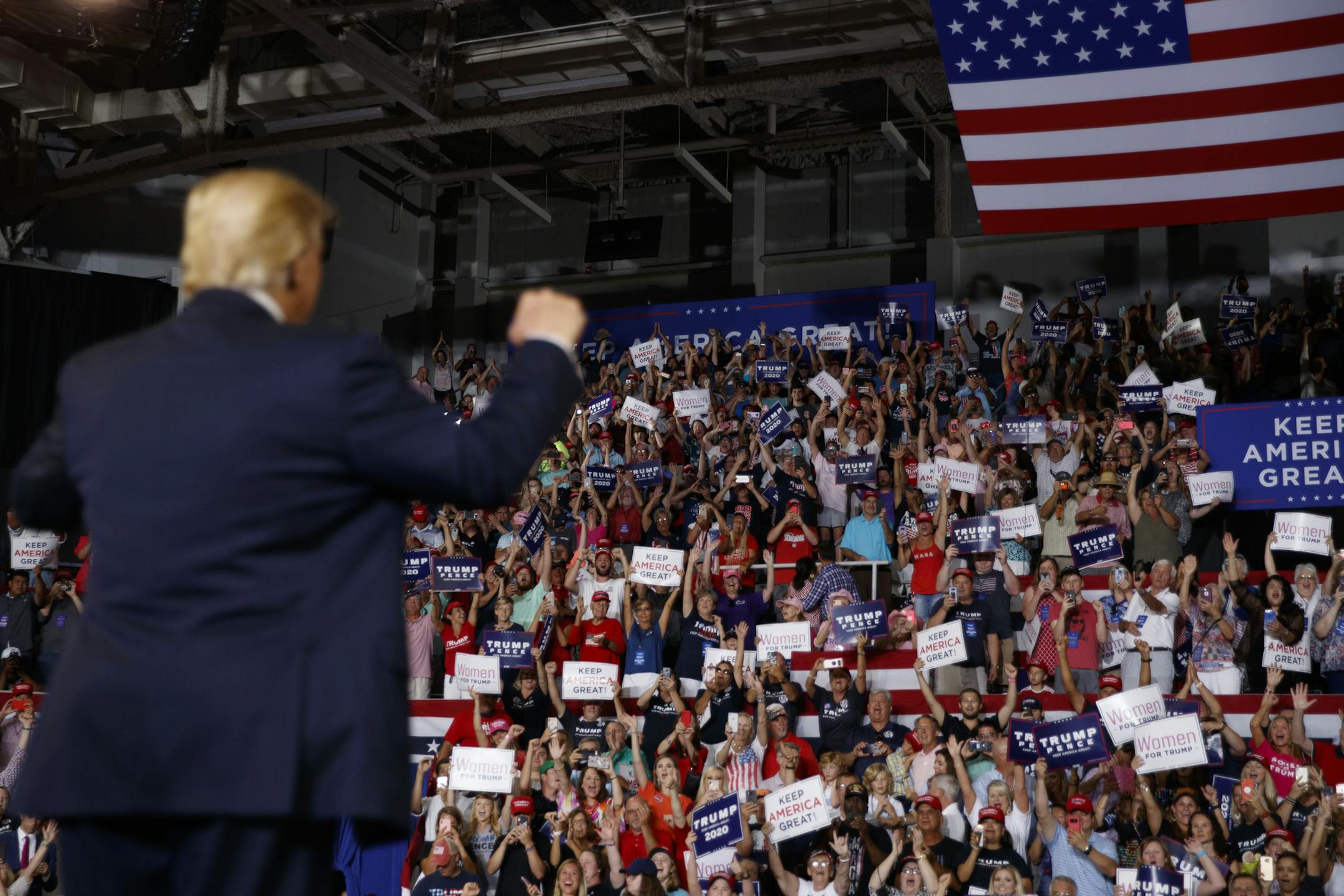 President Donald Trump gestures to supporters at the rally where the crowd chanted "send her back," at the mention of Rep. Ilhan Omar, in Greenville, N.C., July 17, 2019. The impact of the rally for Trump in Greenville, N.C., last week was clear to Democrats: This will be a general election focused on race, identity and the president’s brand of white grievance politics. (Tom Brenner/The New York Times)
