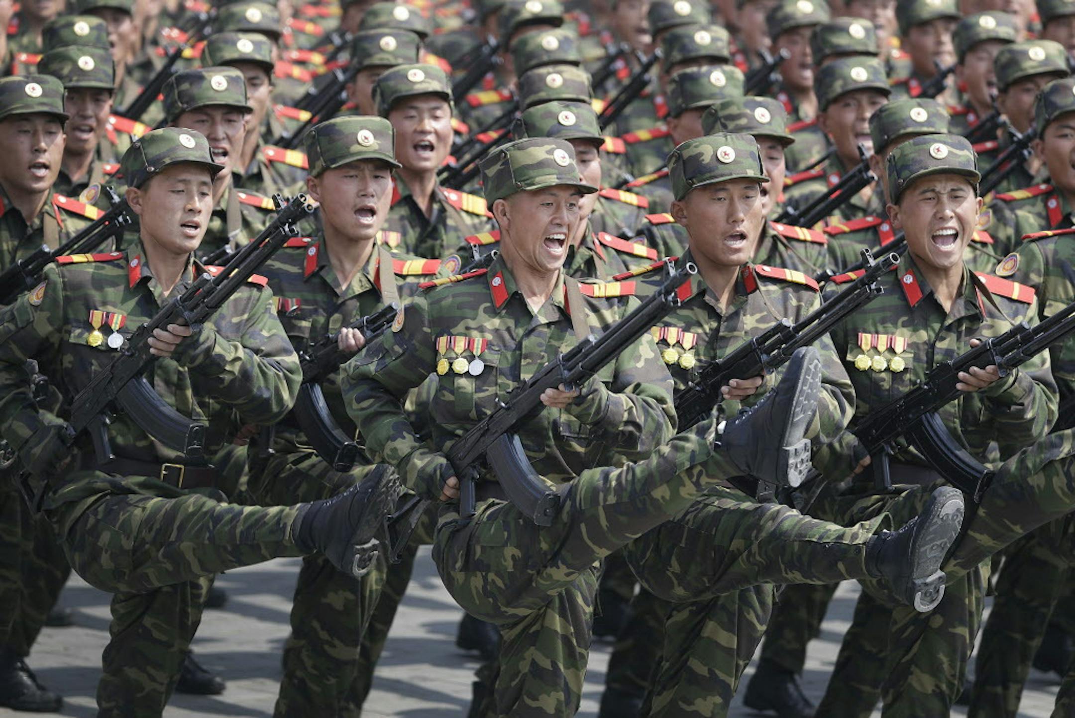 FILE - In this April 15, 2017, file photo, soldiers march across Kim Il Sung Square during a military parade in Pyongyang, North Korea, to celebrate the 105th birth anniversary of Kim Il Sung, the country's late founder and grandfather of current ruler Kim Jong Un. North Korean fury at Washington was rising well before U.S. President Donald Trump took office, in particular over reports that annual U.S.-South Korean military exercises now include training for precision strikes on the North's lead
