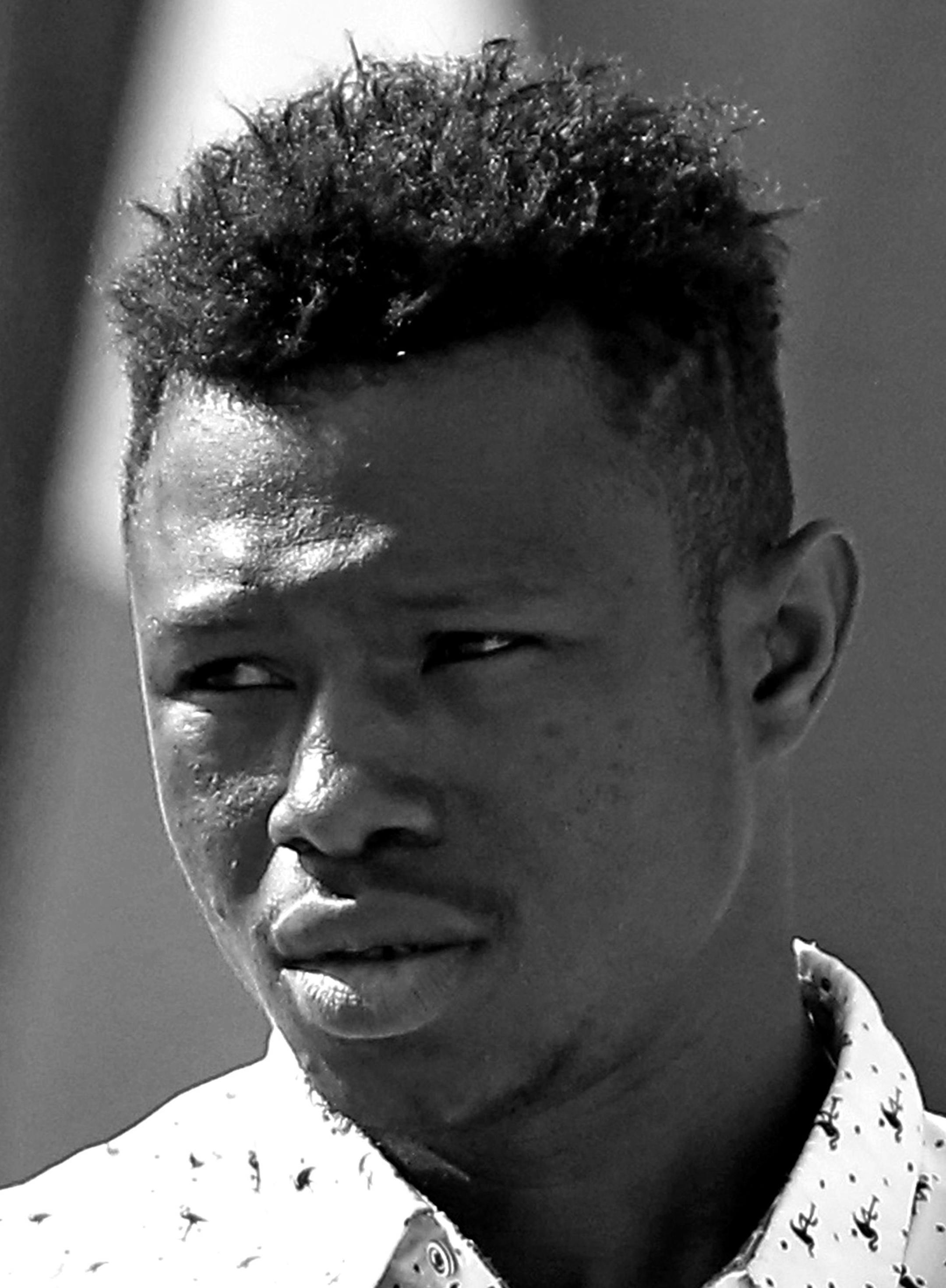 Mamoudou Gassama, 22, from Mali, leaves the presidential Elysee Palace after his meeting with French President Emmanuel Macron, in Paris, Monday, May, 28, 2018. Mamoudou Gassama living illegally in France is being honored by Macron for scaling an apartment building over the weekend to save a 4-year-old child dangling from a fifth-floor balcony. (AP Photo/Thibault Camus, Pool)