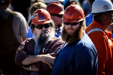 Iron miners listened to Gov. Mark Dayton at a rally in Virginia, Minn., against alleged illegal steel dumping from Asian countries.