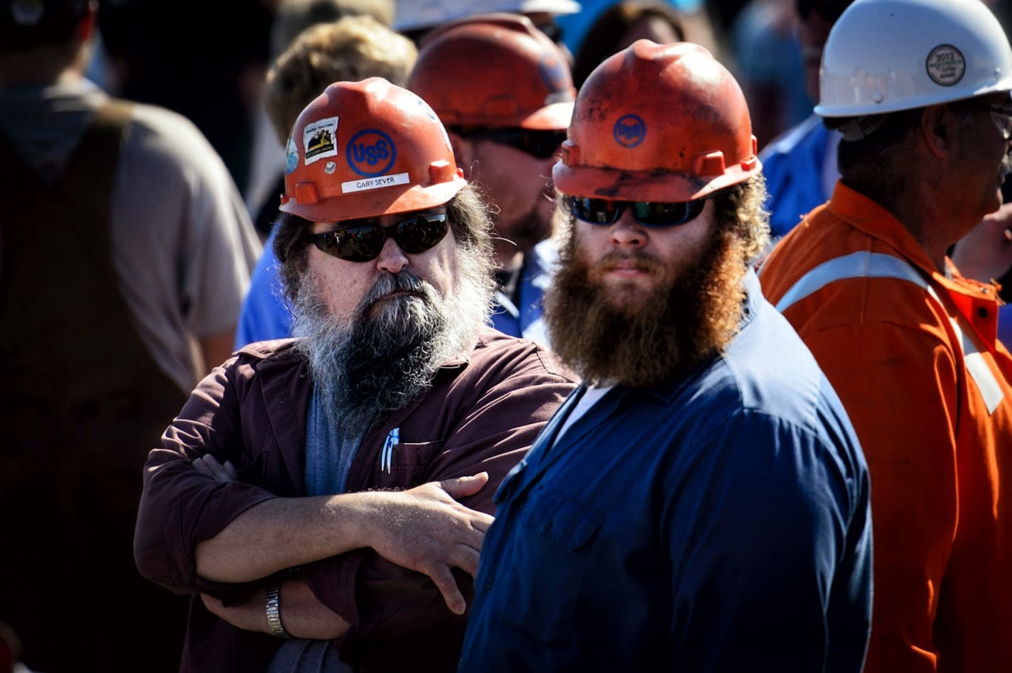 Iron miners listened to Gov. Mark Dayton at a rally in Virginia, Minn., against alleged illegal steel dumping from Asian countries.