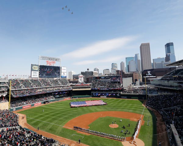 Four T-38s from the U.S. Air Force fly over Target Field in Minneapolis during the national anthem before a Minnesota Twins game.