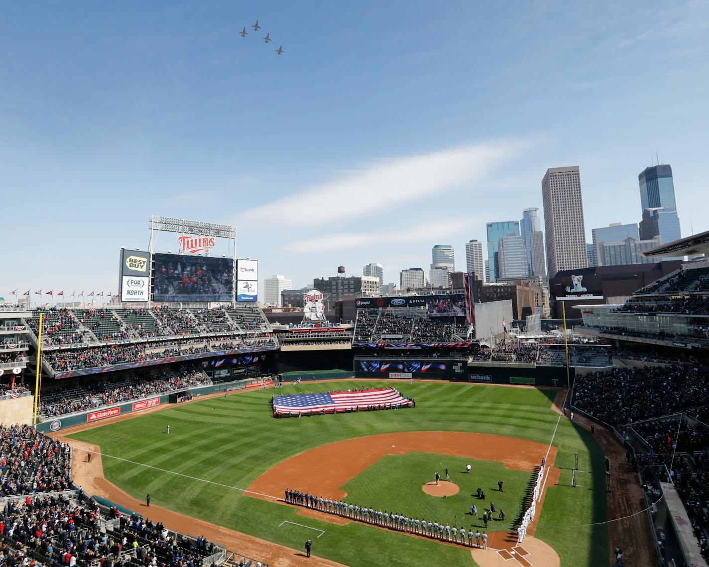 Four T-38s from the U.S. Air Force fly over Target Field in Minneapolis during the national anthem before a Minnesota Twins game.